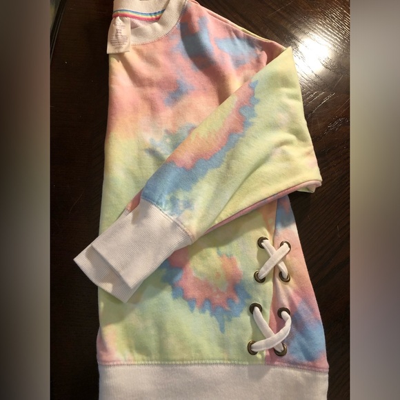 Secret Treasures Tops - Secret Treasures Tie dye sweatshirt with tied sides.